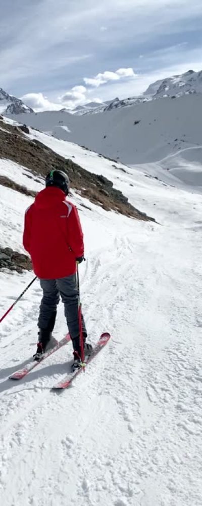 POV skiing on skis at Zermatt ski resort, Mattertal, Valais canton, Switzerland, in winter. Model released.
